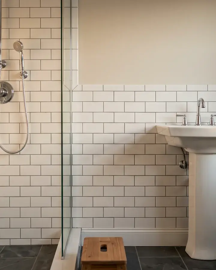 A rebuilt bathroom wall with new framing and drywall